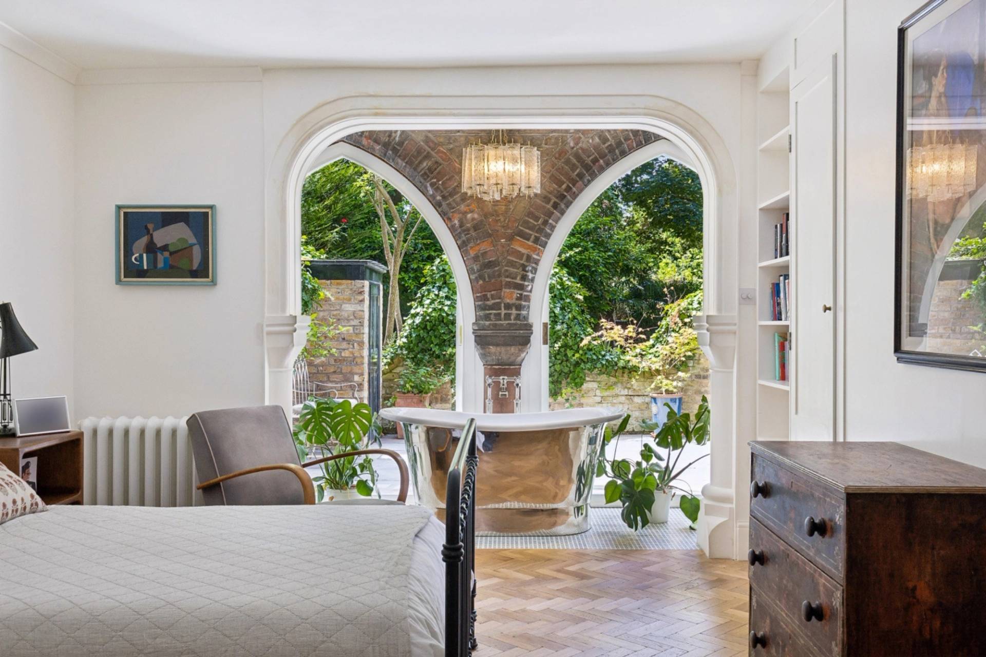 Bedroom view showing gothic brick arched alcove bath area in Hampstead NW3 from Love Locations.