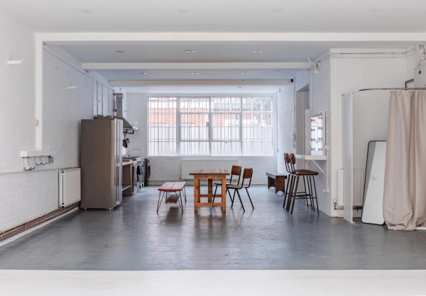 Industrial photography studio setup with lighting and props at Brixton Warehouse Love Locations.