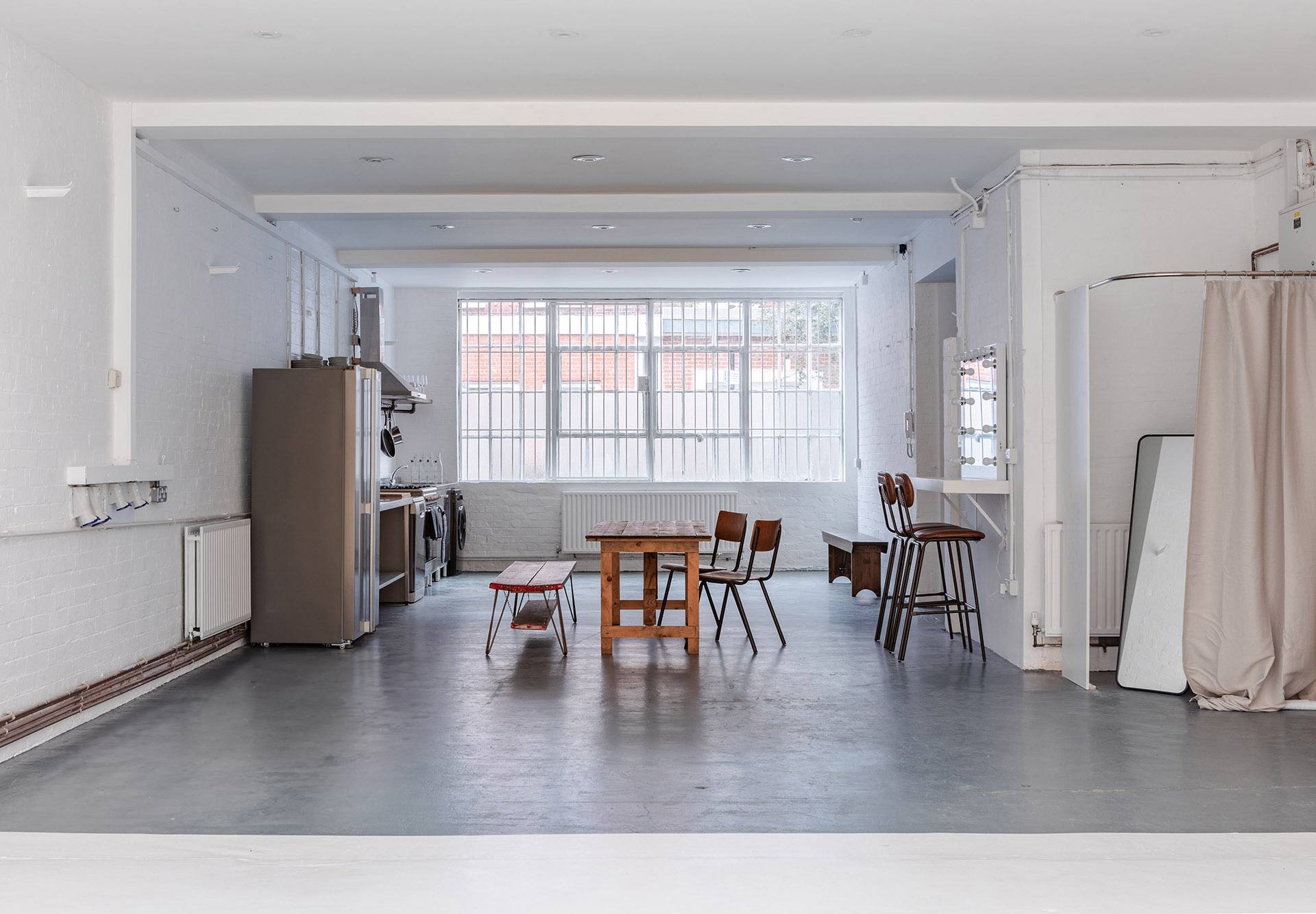 Industrial photography studio setup with lighting and props at Brixton Warehouse Love Locations.
