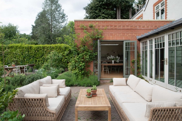 Spacious garden of a modern home in Horsley, Surrey with clean lines and minimalist design, represented by Love Locations.