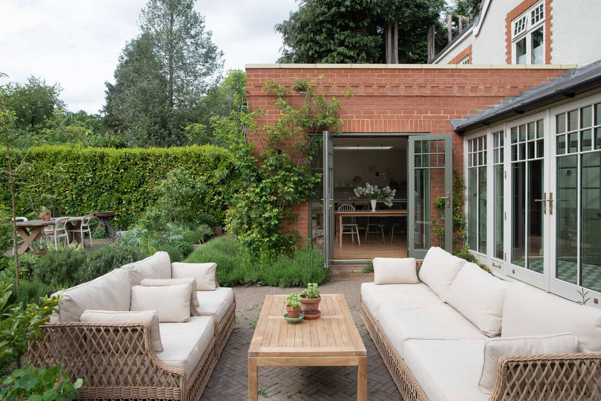 Spacious garden of a modern home in Horsley, Surrey with clean lines and minimalist design, represented by Love Locations.