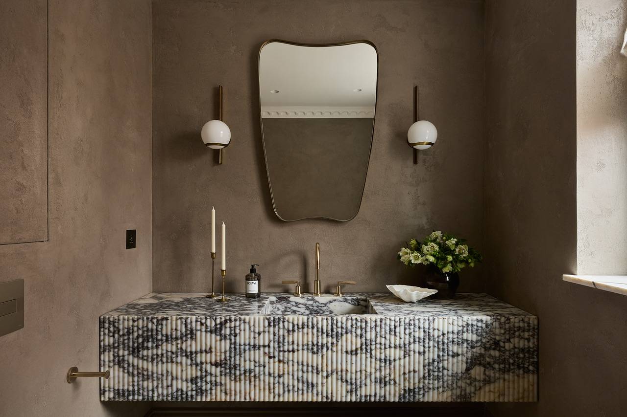 High-end bathroom feature showcasing a spectacular, solid-blocked blue and grey marble vanity basin, perfect for luxury stone craftsmanship lookbooks, Love Locations.