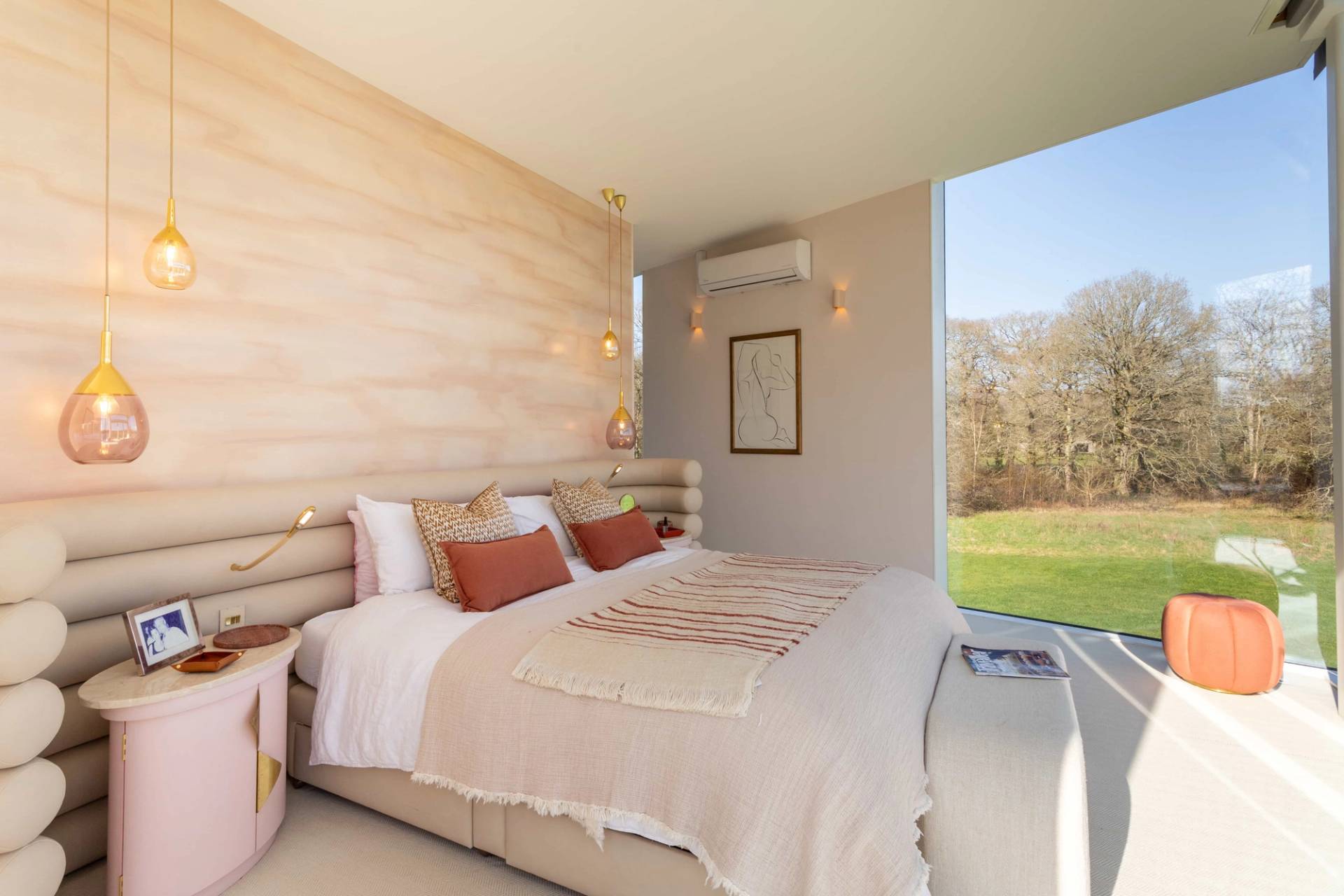 Love Locations premium residential location Surrey: Airy bedroom suite with clean neutral tones, minimalist furnishings, and integrated lighting, tailored for home product commercials.