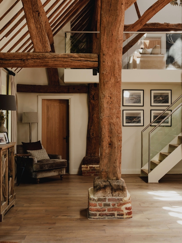 Detail of an authentic exposed wooden support post and brick pedestal in a converted Oxfordshire barn, ideal for rustic texture backdrops, Love Locations RG9.