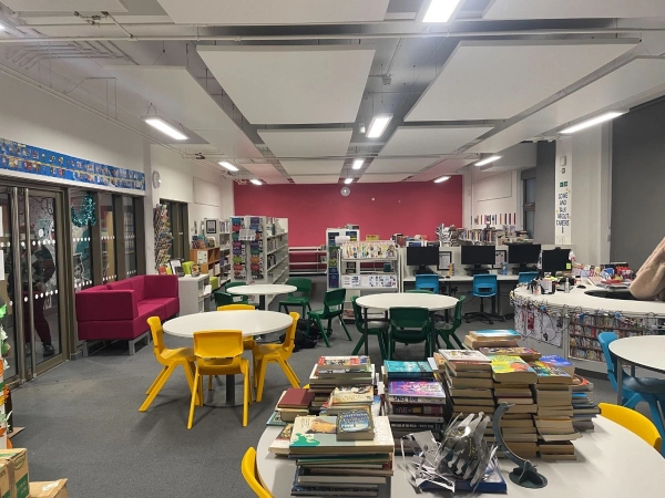 Love Locations library shoot location Reading: Bright school library and study room with book displays and collaborative working desks, configured for student brand campaigns.