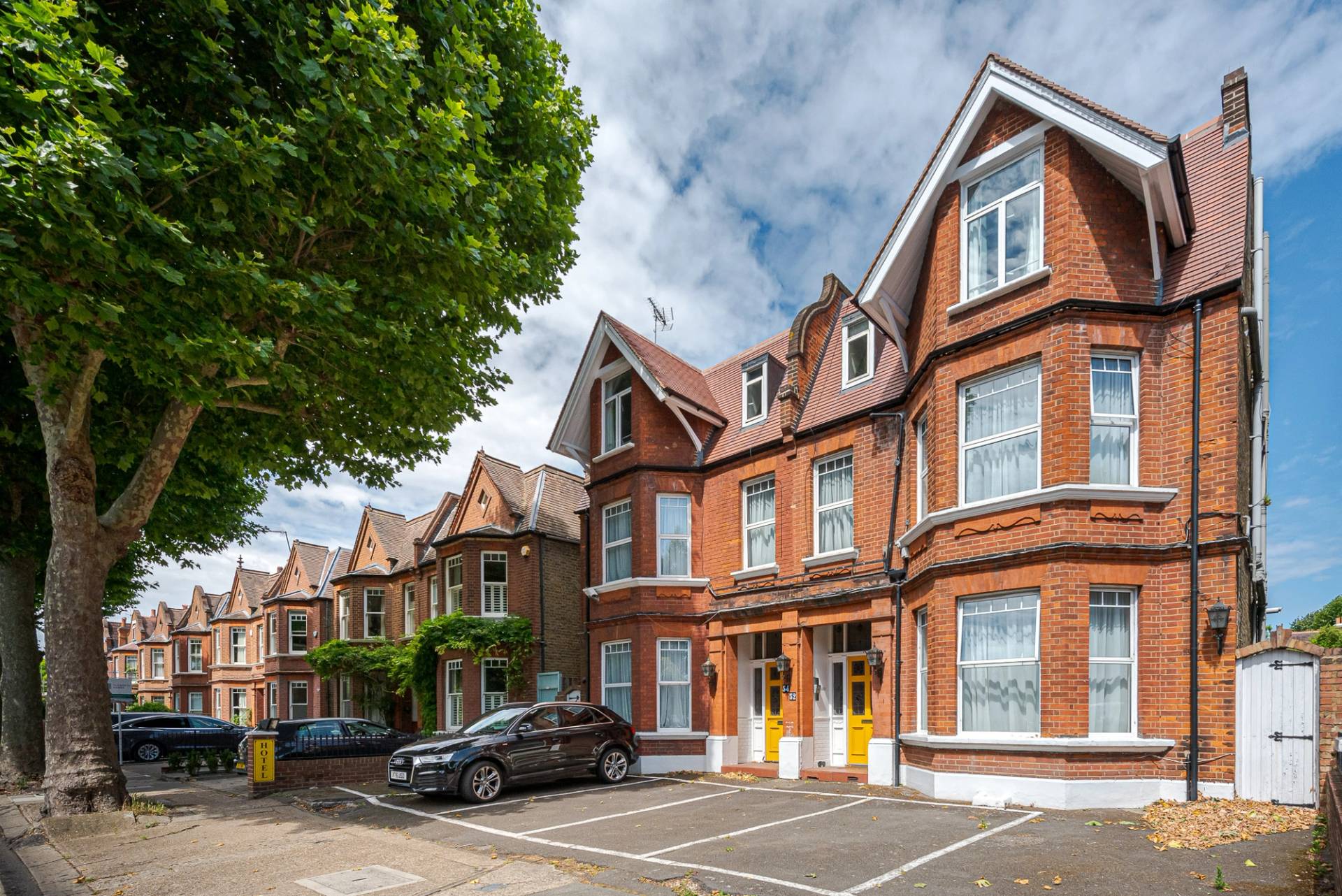 Former West London hotel with ten bedrooms, garden and timeworn interior character