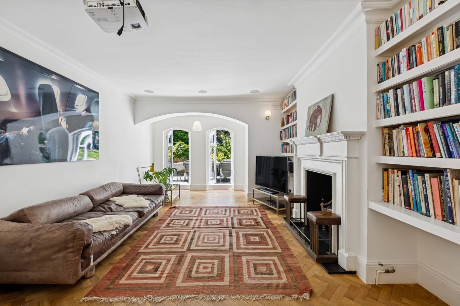 Modern living room film location with parquet flooring and fireplace in a Hampstead NW3 home available via Love Locations.