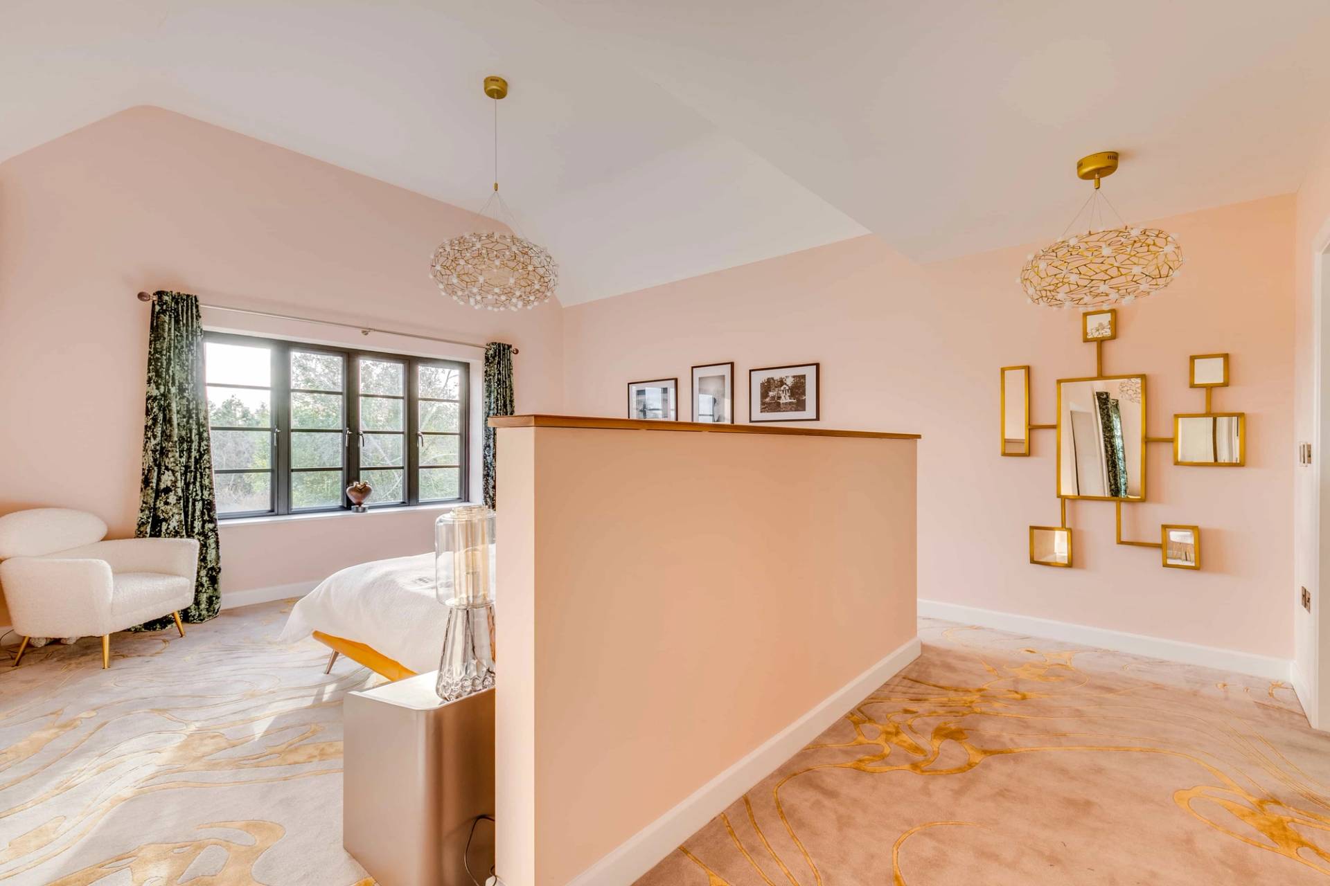 Master bedroom suite with a low partition wall separating the sleeping area from a dressing room, Love Locations CB2.
