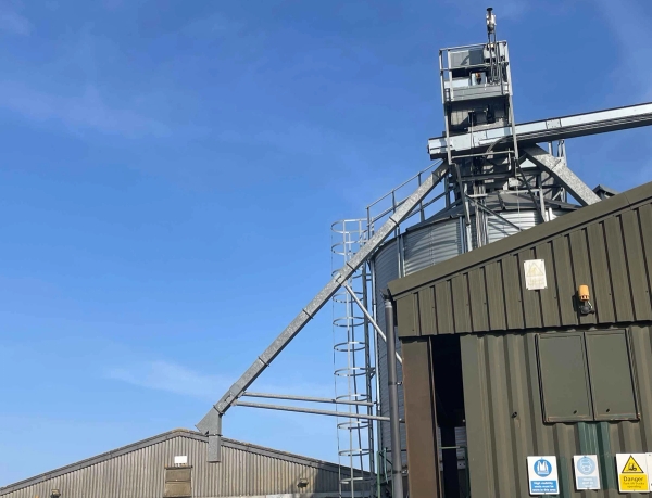 Large agricultural grain silos and metal storage facilities on a rural Northamptonshire estate, ideal for industrial commercial shoots, Love Locations NN17.