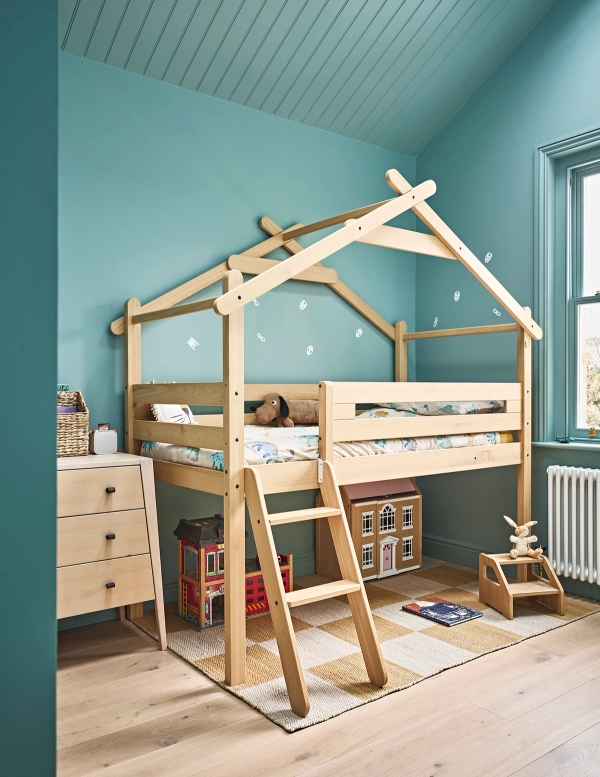Children's bedroom featuring a wooden house-shaped bunk bed frame and teal painted walls, Love Locations SE21.