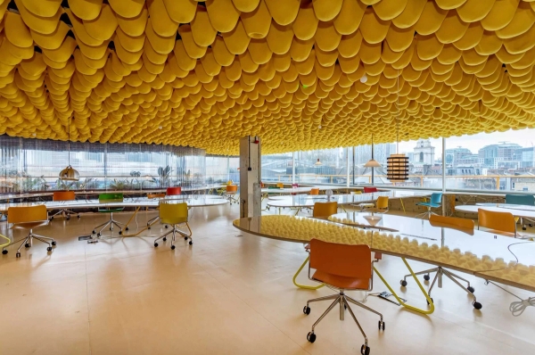 Contemporary collaborative workspace with colourful ceiling design and city views in Whitechapel East London – love locations