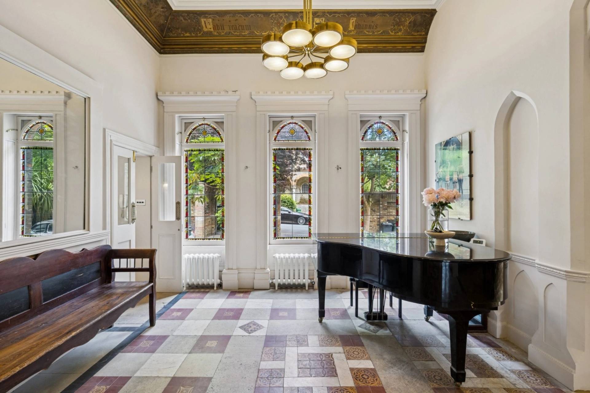 Gothic arched sash windows and grand piano detail in a Hampstead NW3 location house curated by Love Locations.
