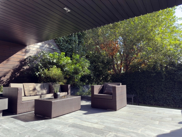 Private garden patio at Love Locations Highgate Zen home with outdoor seating area.