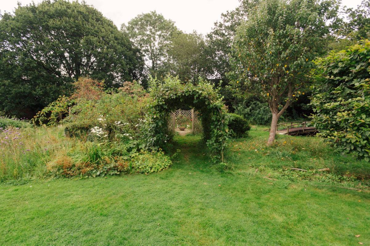 Archway hedge tunnel in a landscaped country garden, perfect for romantic film scenes, Love Locations SE15.