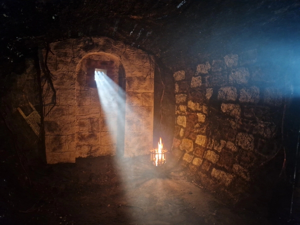 Atmospheric stone brick vault interior with a light beam shining through a high window, Love Locations BN8.