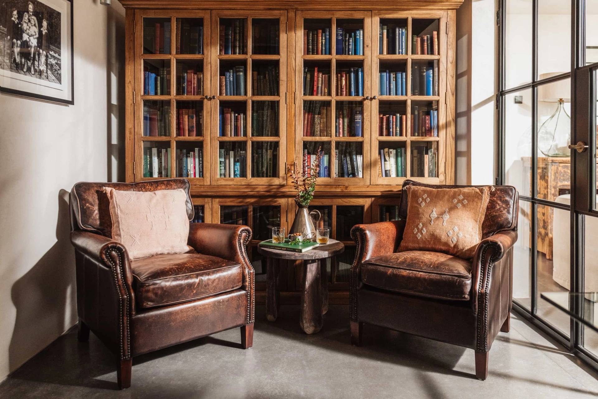 Classic home library location house in Castleblayney County Monaghan Ireland through Love Locations, featuring floor-to-ceiling wooden bookshelves and leather armchairs.