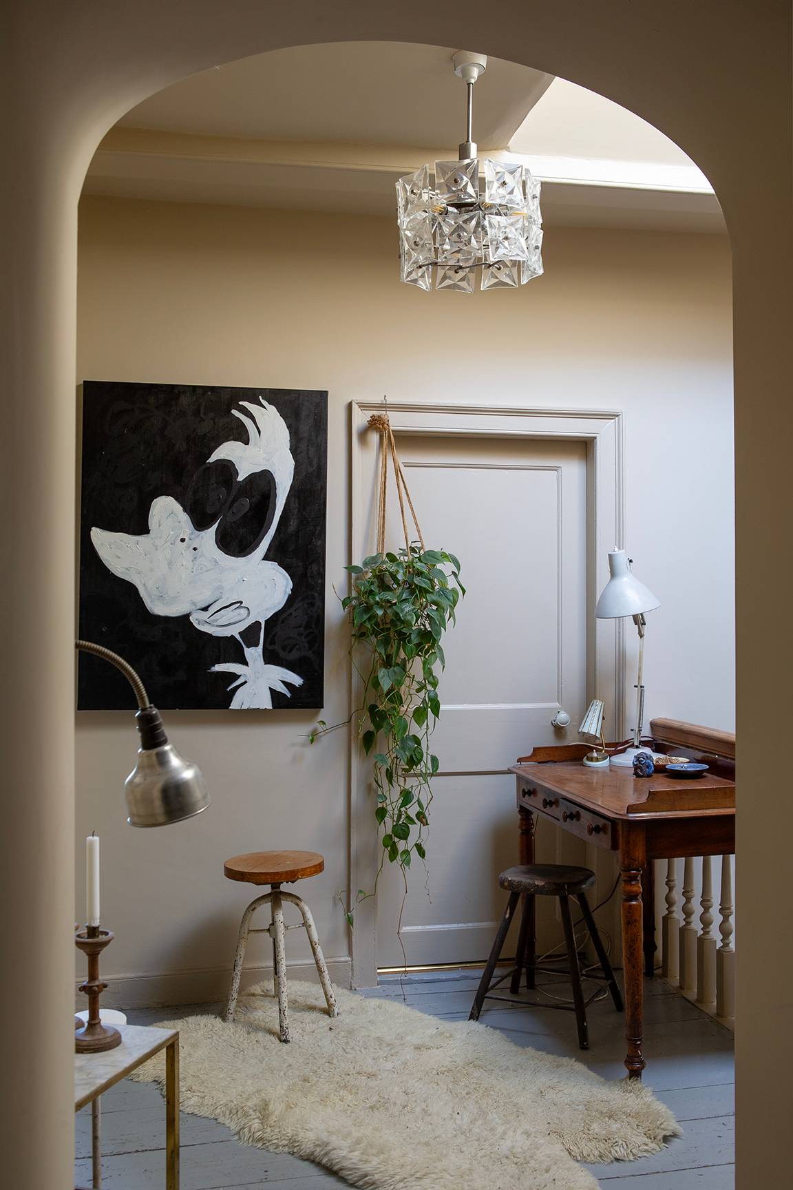 Hallway study nook with a wooden desk, stool, and abstract wall art, Love Locations ME13.