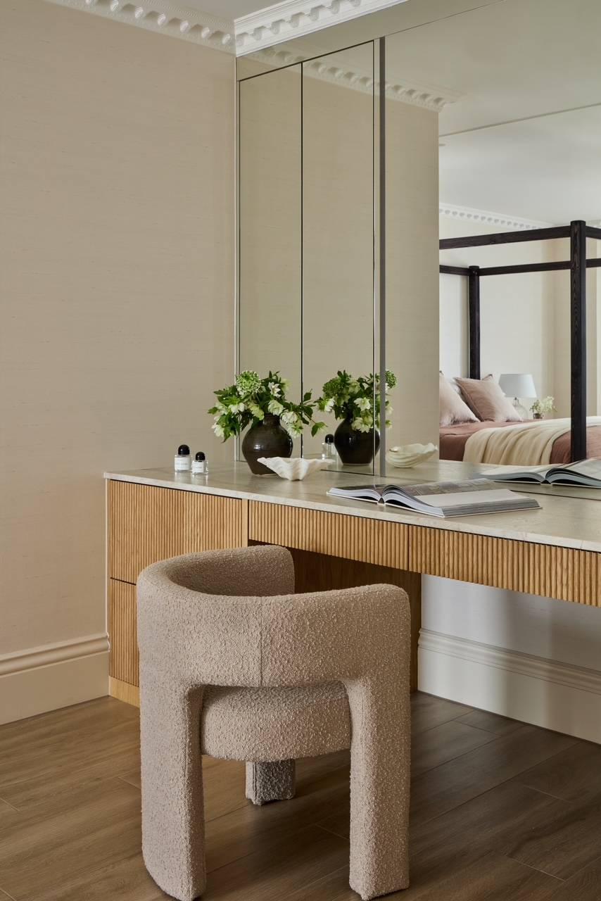 Elegant dressing room vanity table featuring a fluted oak facade and a modern bouclé swivel chair, ideal for beauty brand digital content creation, Love Locations.