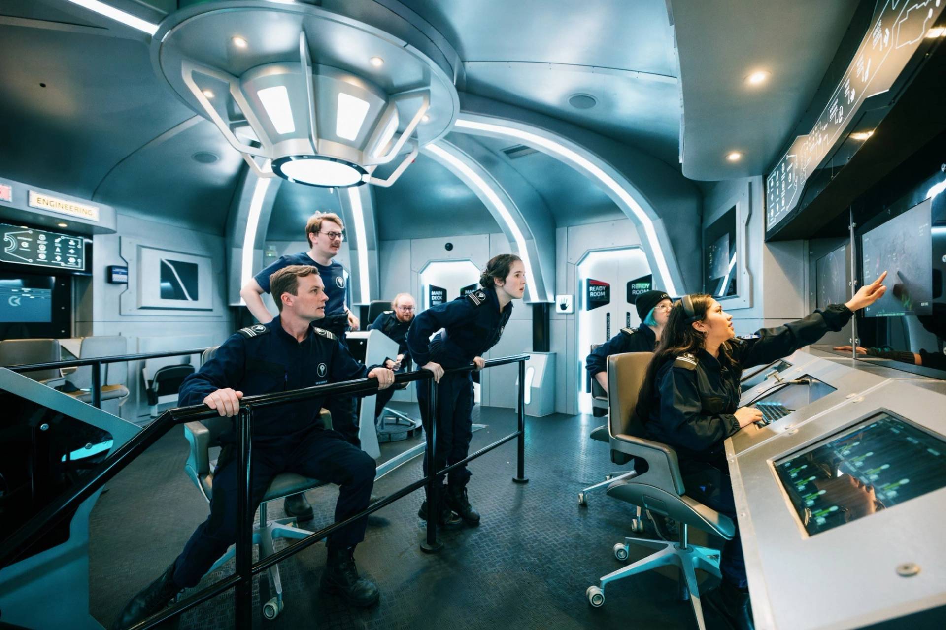 Production cast filming inside a premium spaceship command center location house in London, booked via Love Locations.