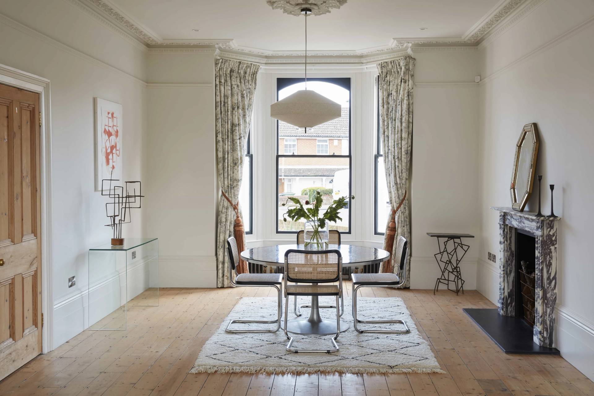 Light-filled dining room with a large bay window, dining table set, and original ceiling cornicing, ideal for homeware lookbooks, Love Locations TN34.