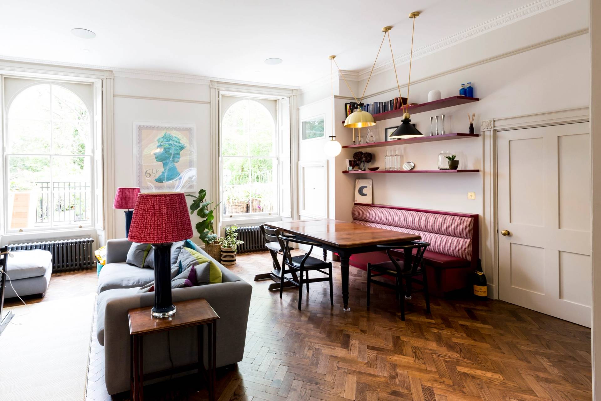 Spacious open-plan kitchen dining room in Camberwell, SE5 with parquet wood flooring and leather booth seating via Love Locations.