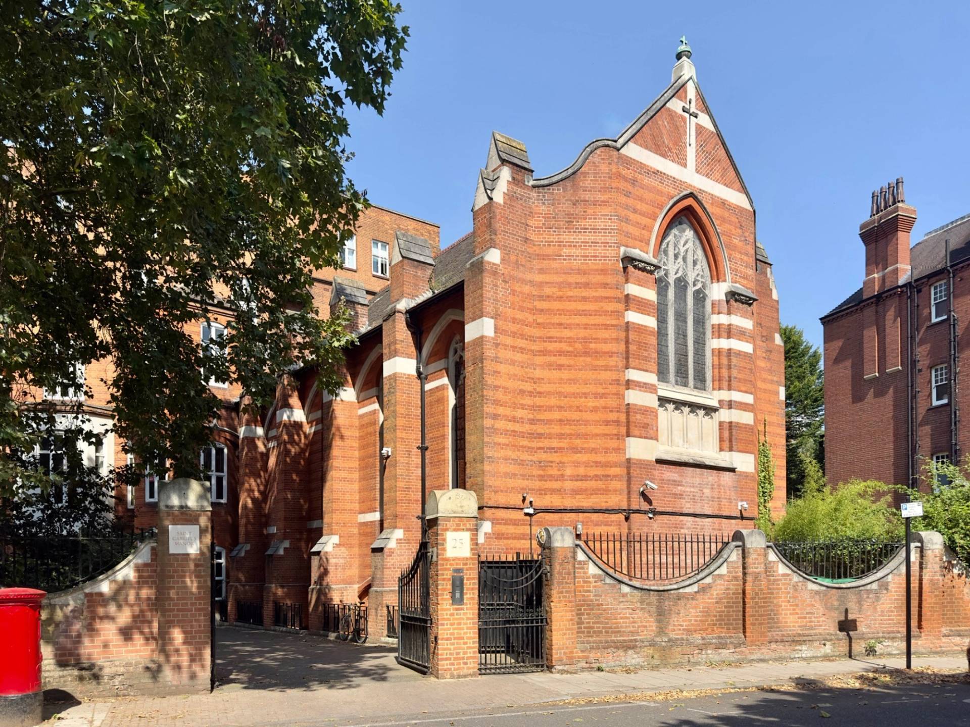 Wide exterior view of the historic red brick converted church filming and event venue in Oval SE5 by Love Locations.
