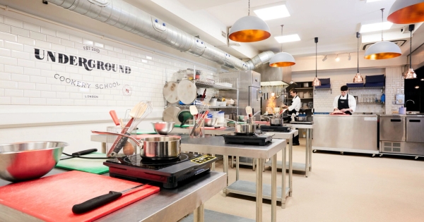 Bright food photography studio setup with portable induction hobs and vibrant prep ingredients, bookable through Love Locations.