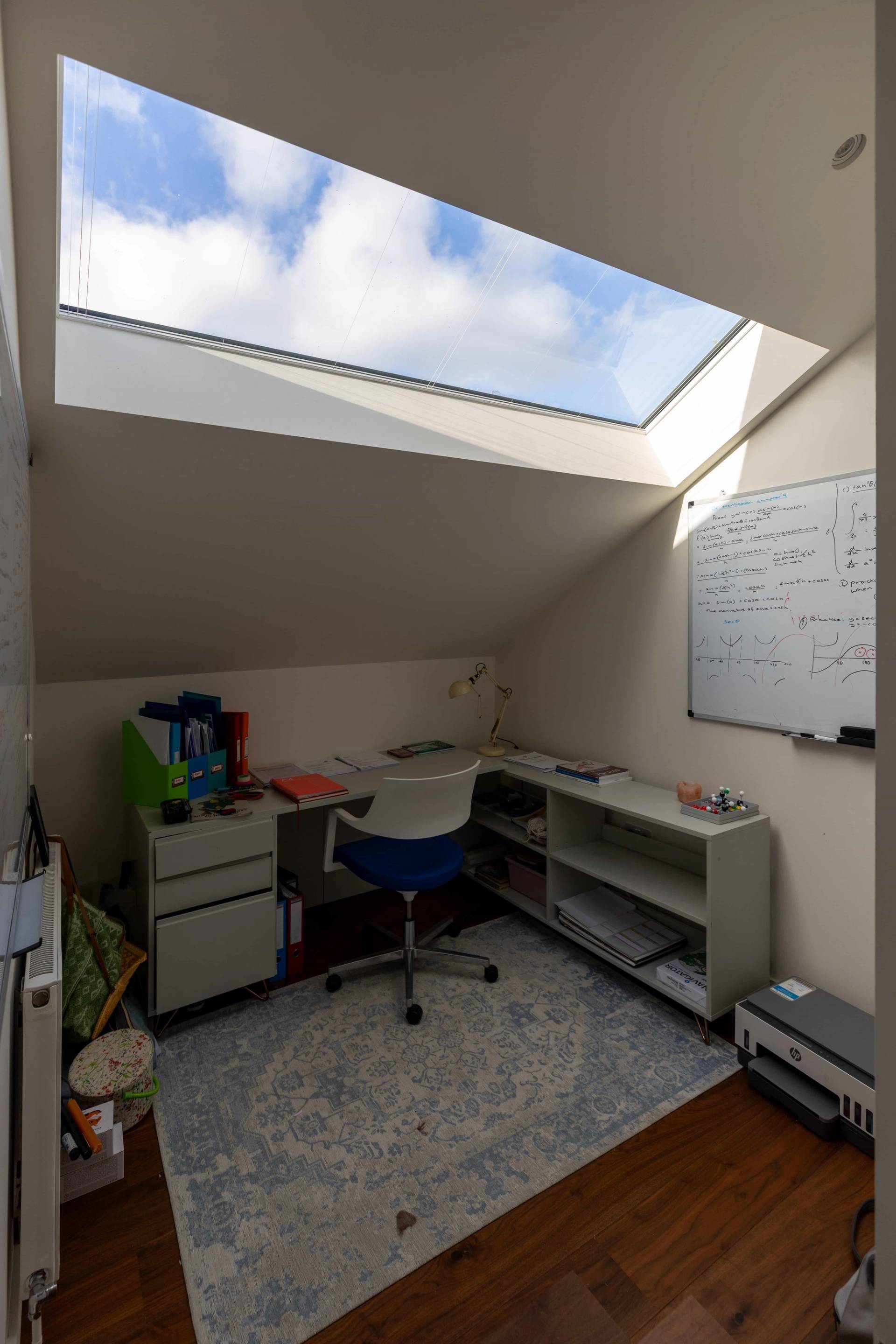 Landing with wood flooring and bright interior