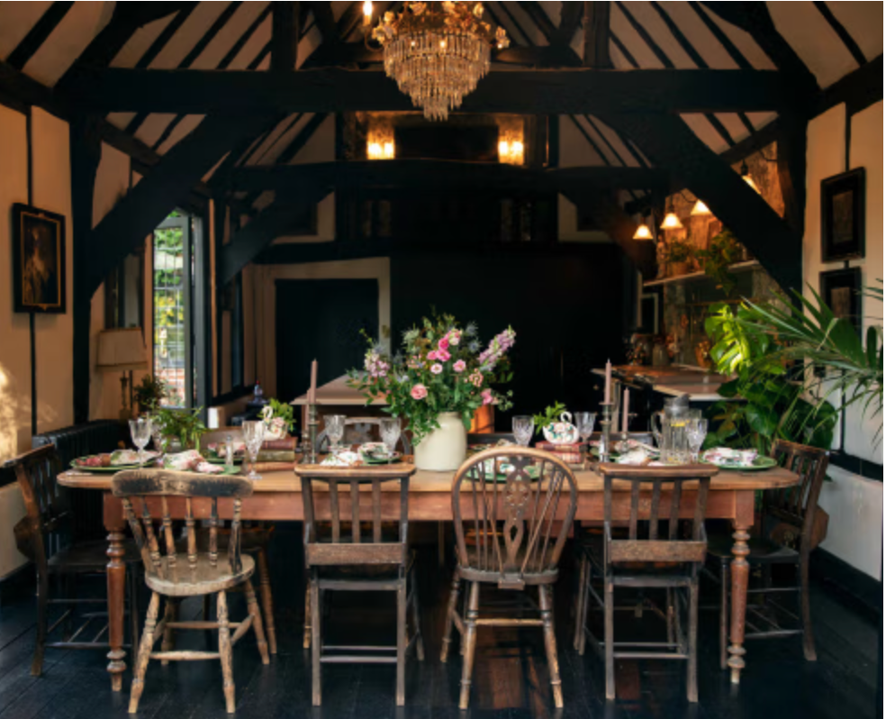 Vaulted dining room at Agatha featuring exposed Tudor beams, chandelier, long dining table and heritage interiors ideal for Christmas entertaining scenes.