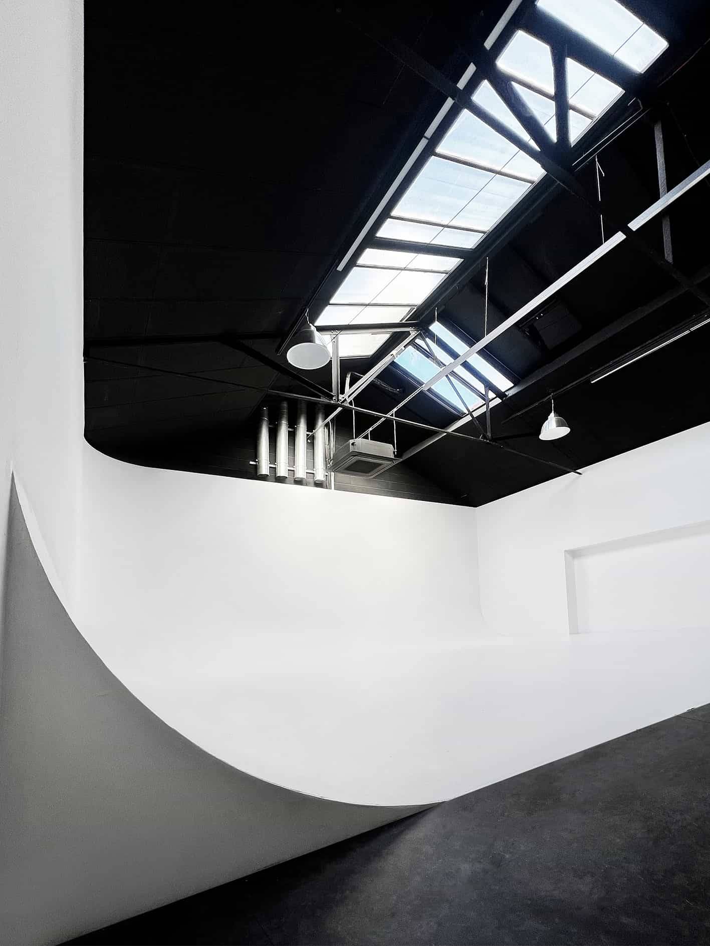 Industrial photo studio with curved cyclorama wall in Acton W3 West London – Love Locations