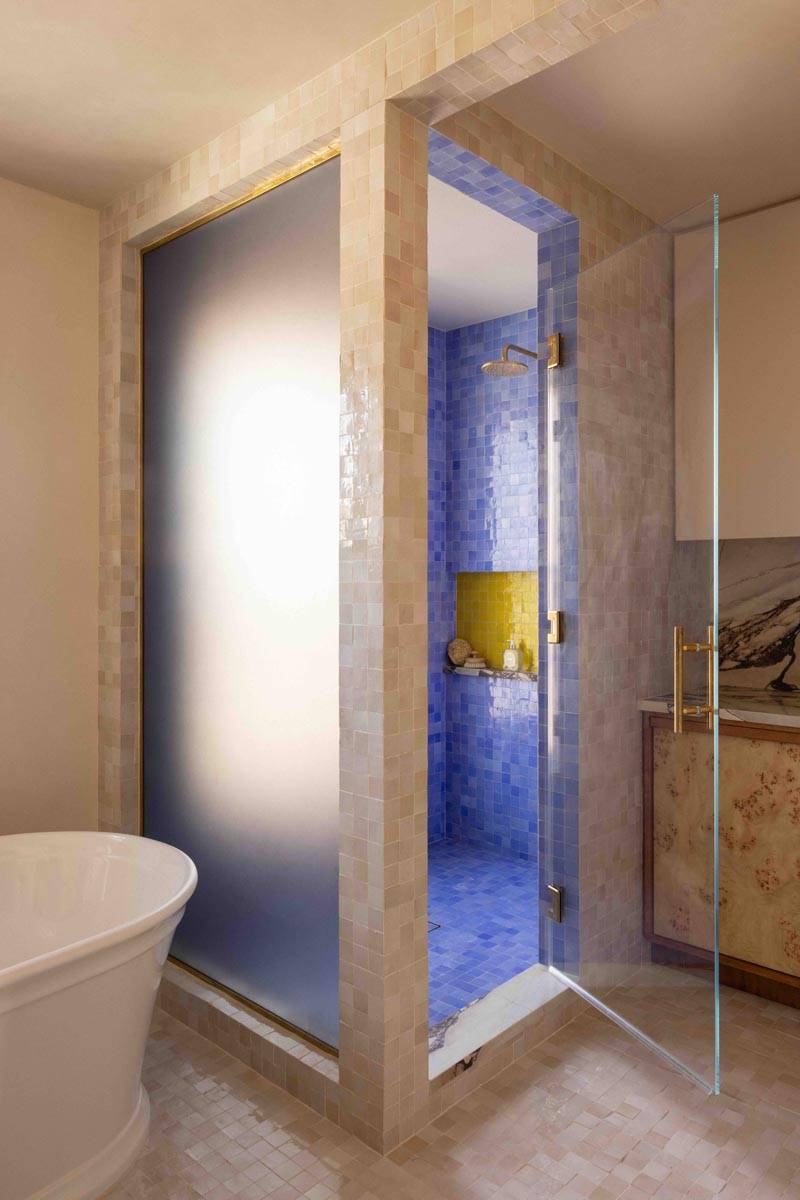 Vibrant blue mosaic-tiled walk-in shower shoot location in a 19th-century Brooklyn townhouse available via Love Locations.