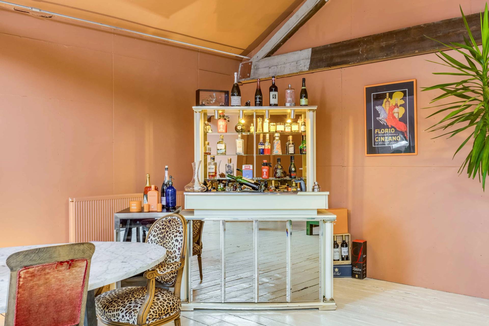 Bespoke vintage home bar setup with illuminated shelves, perfect for cocktail lifestyle and film shoots, Love Locations.
