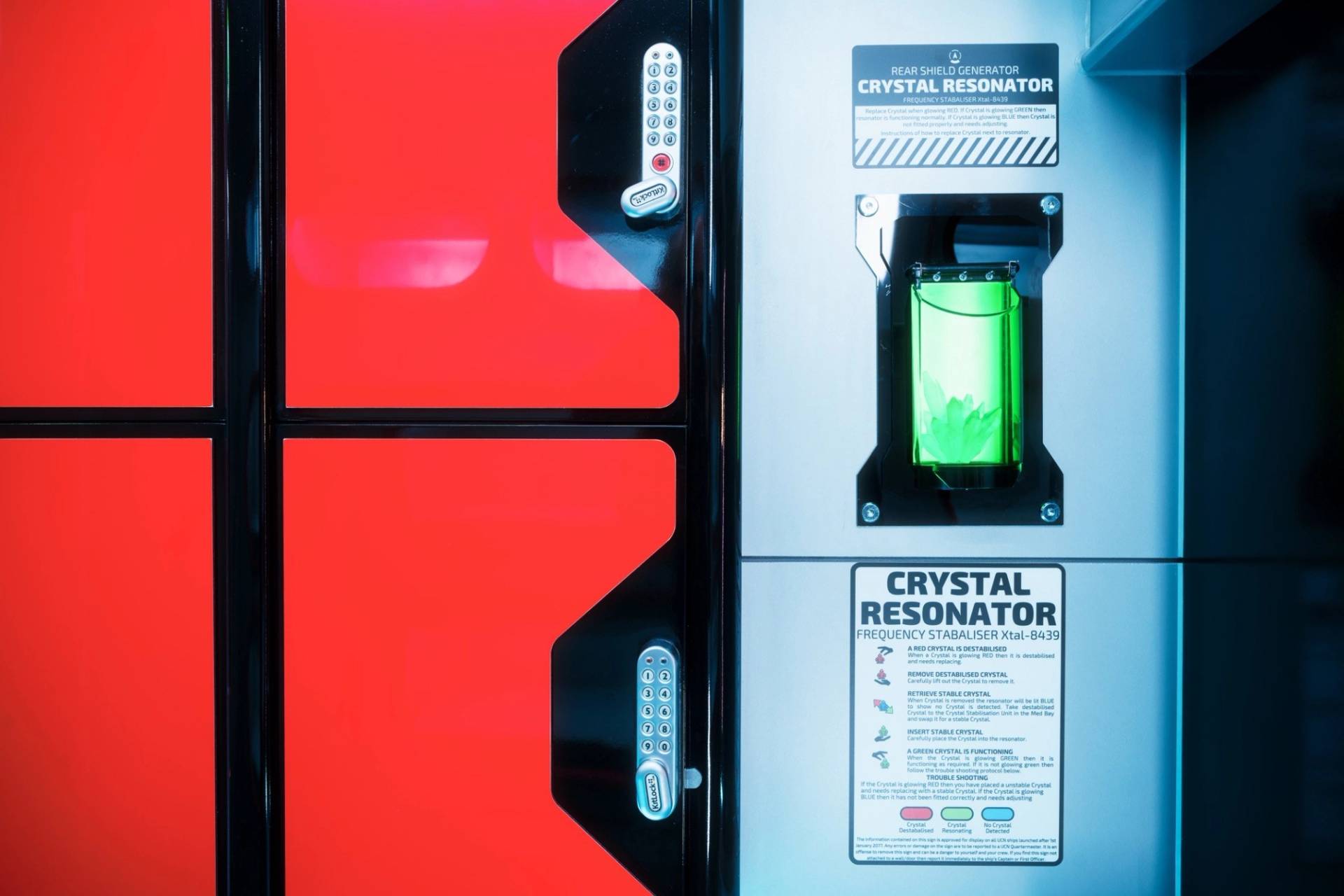 Bespoke sci-fi prop station labeled 'Crystal Resonator' featuring glowing green fluid tubes, via Love Locations Lambeth.