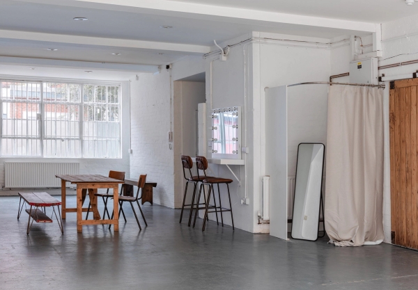 Large industrial photography studio with high ceilings and open floor at Love Locations Brixton Warehouse.