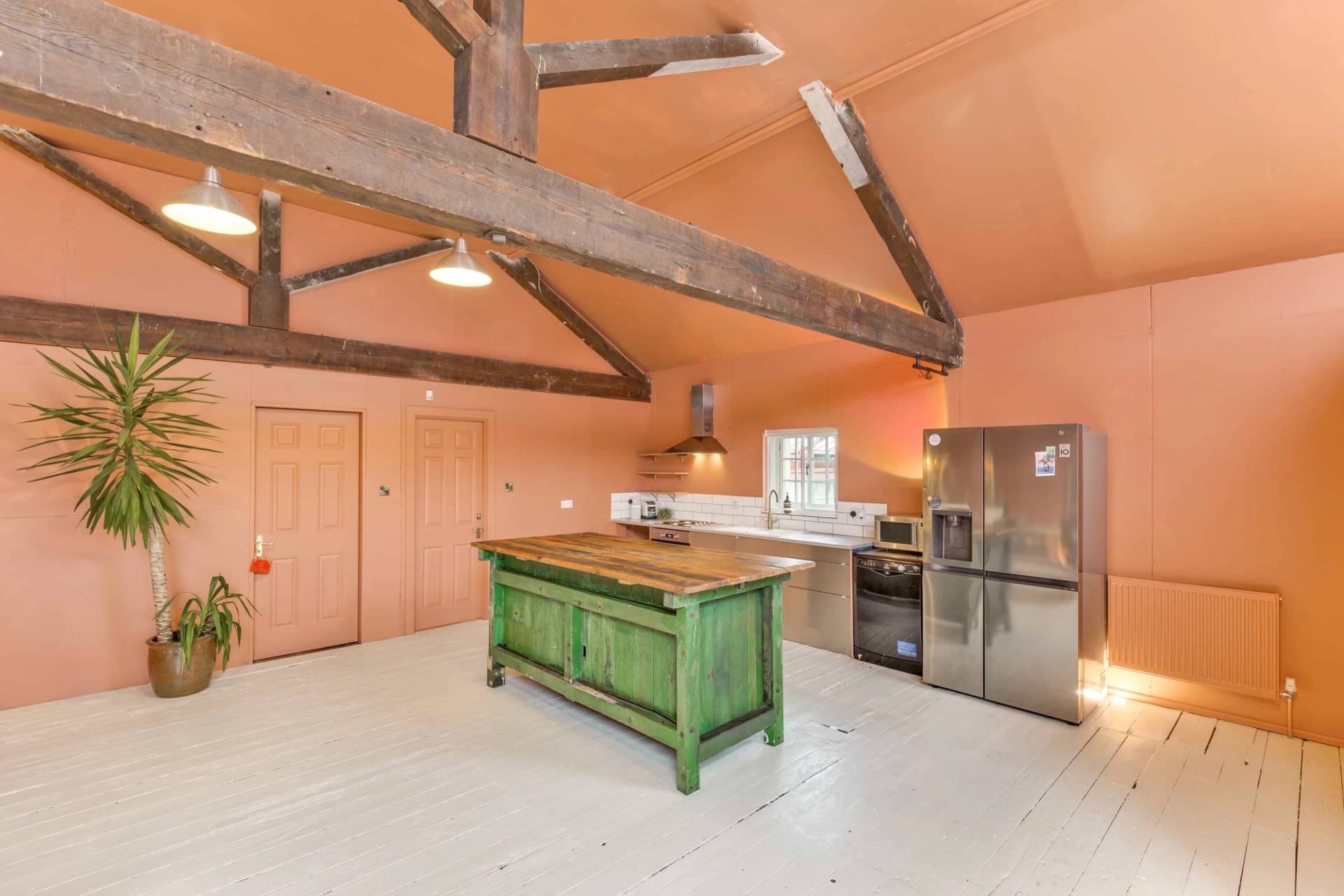 Industrial loft kitchen with exposed timber framework, suitable for commercial filming and TV series, Love Locations.