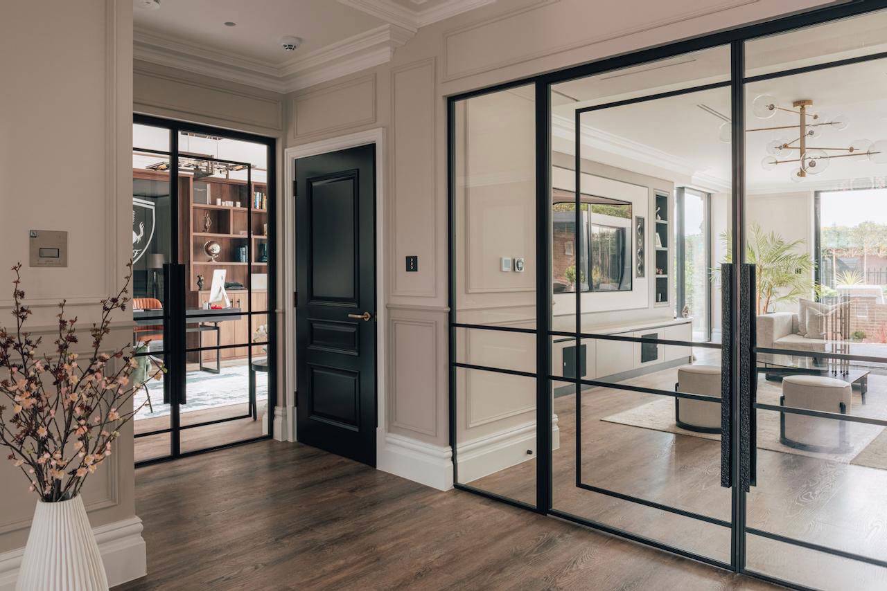 Black glass internal doors looking into a luxury home office and hallway landing in Ealing, Love Locations W5.