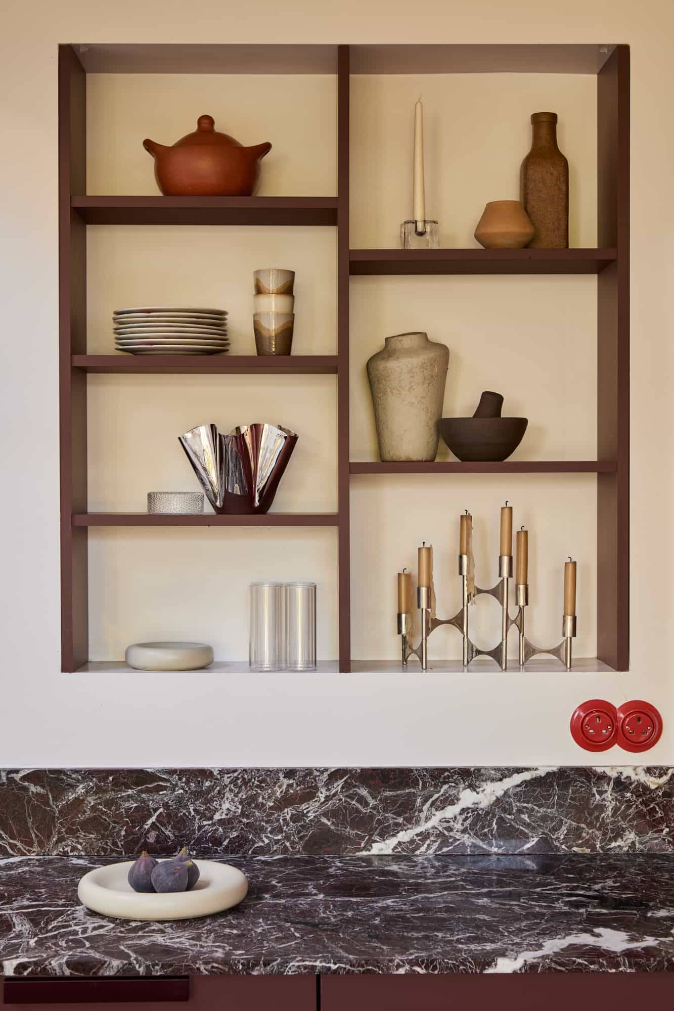 Love Locations curated prop styling location SE23: Recessed wooden display alcove featuring artisan ceramics and marble counters, a sophisticated setting for lifestyle brand shoots.