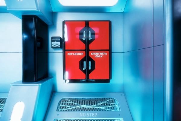 Bright orange spaceship emergency locker panel with warning labels for sci-fi background action, Love Locations.