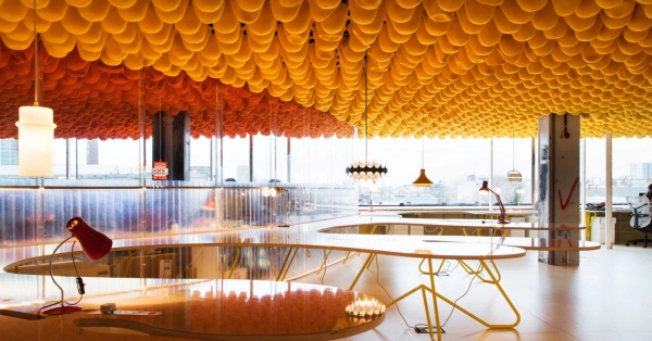 Modern open workspace with sculptural orange ceiling and panoramic windows in Whitechapel London E1 – love locations