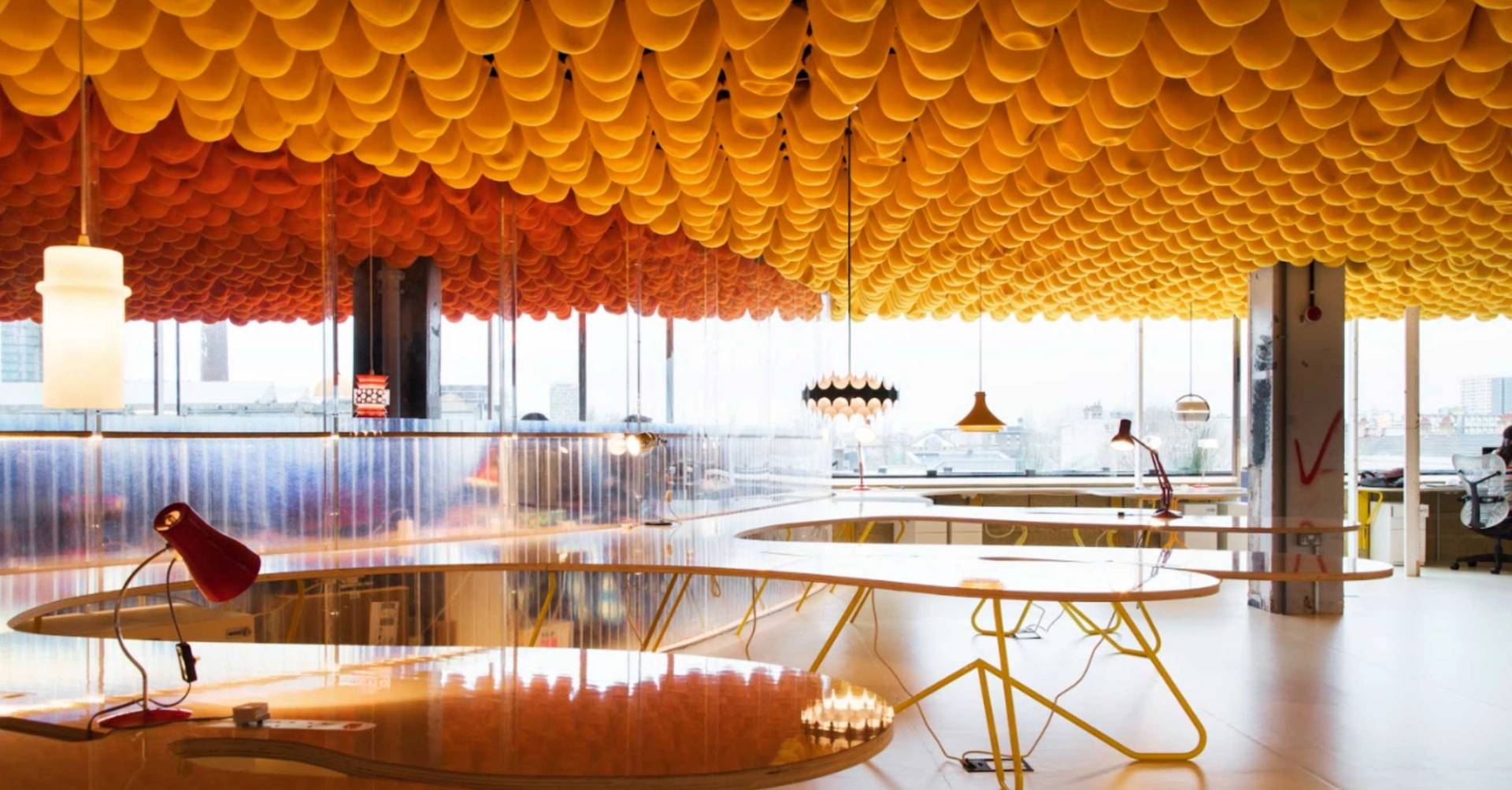 Modern open workspace with sculptural orange ceiling and panoramic windows in Whitechapel London E1 – love locations