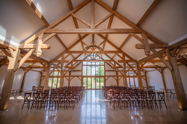 Spacious oak-framed barn venue set up for corporate events and private parties in Sussex, bookable via Love Locations.