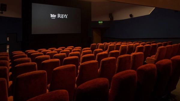 Side view of the plush red velvet theater seating rows facing the projection screen at The Ritzy Screen 3 shoot location in Brixton SW2 by Love Locations.