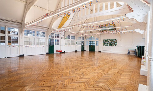 Impressive vaulted ceiling Victorian school hall location space, ideal for period dramas and film productions, curated by Love Locations.