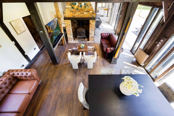 Contemporary barn living room with fireplace in RM4 Essex – Love Locations