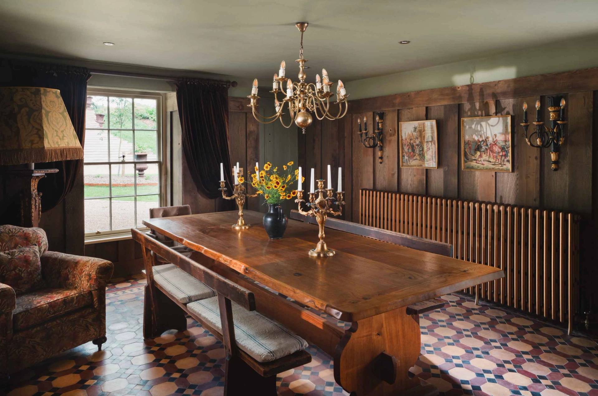 Grand period dining hall with wooden paneling and chandelier lighting in Newquay Cornwall TR8 through Love Locations.