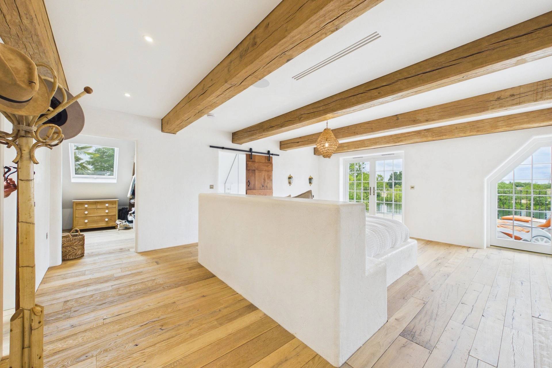 Love Locations Mediterranean-style bedroom with rustic beams for filming