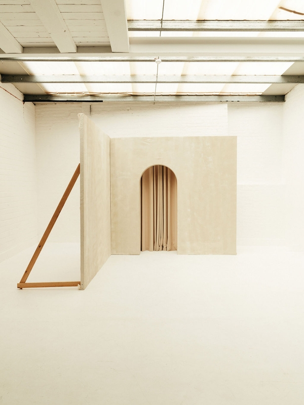 Custom set build with a white panelled wall styled as a theatre backdrop for events at Brixton Warehouse Love Locations.