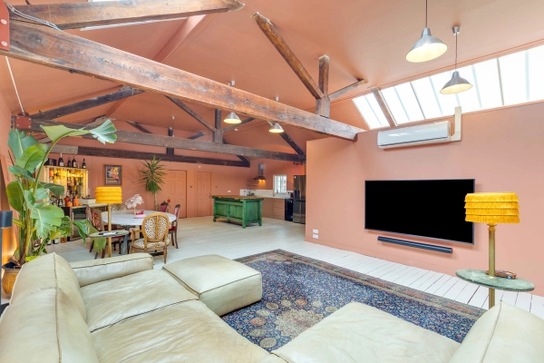 Unique residential warehouse location with high ceilings, exposed woodwork, and abundant natural skylight, Love Locations.