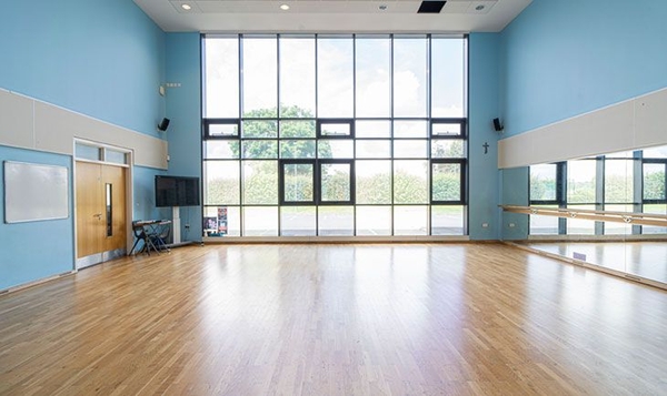 Love Locations daylight performing arts studio London SE2: Bright dance studio with large double-height windows and polished floors, perfect for fashion lookbooks and commercial filming.
