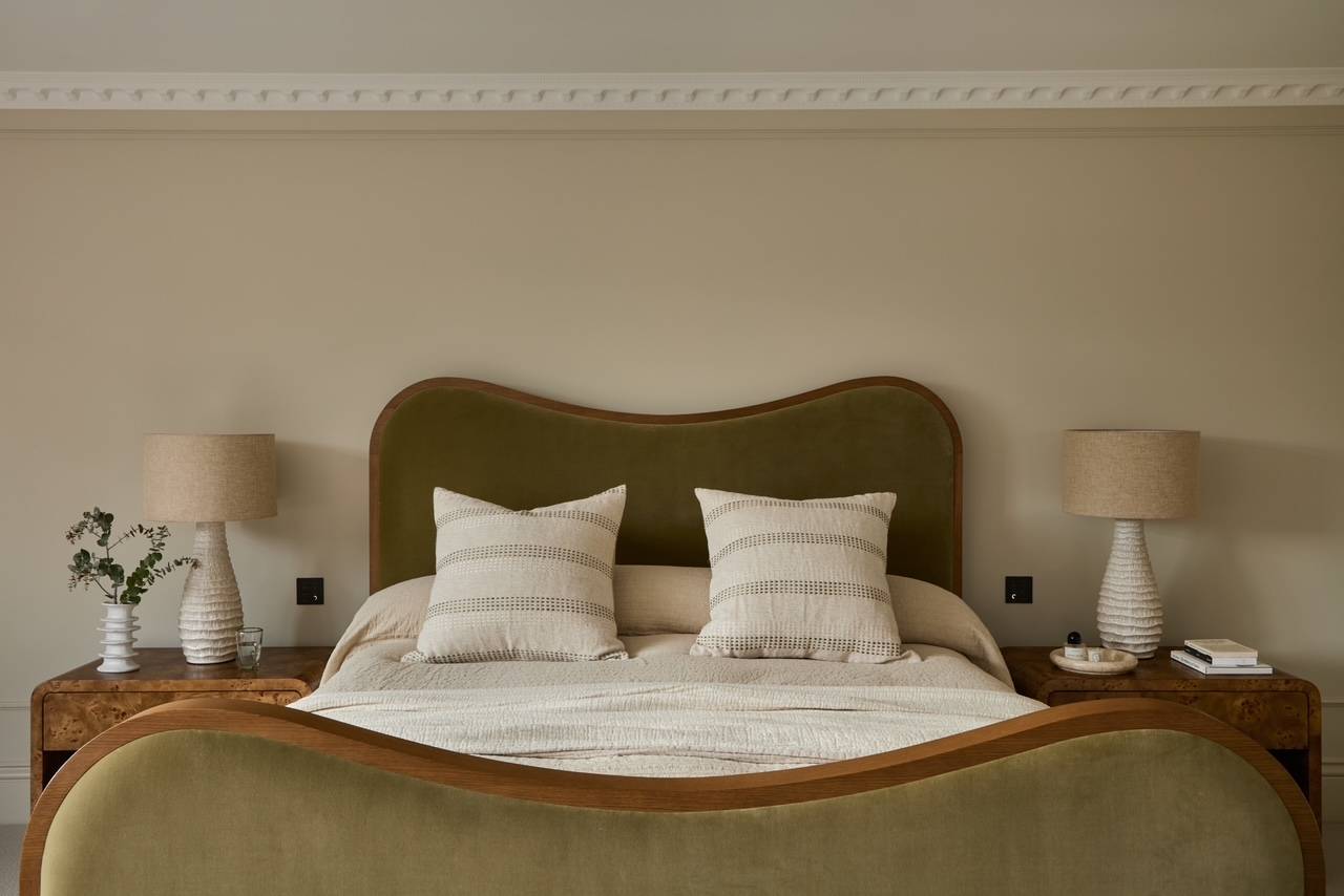 Symmetrical bedroom layout highlighting a bespoke curved velvet headboard and neutral interior styling, perfect for luxury bedding lookbooks, Love Locations.